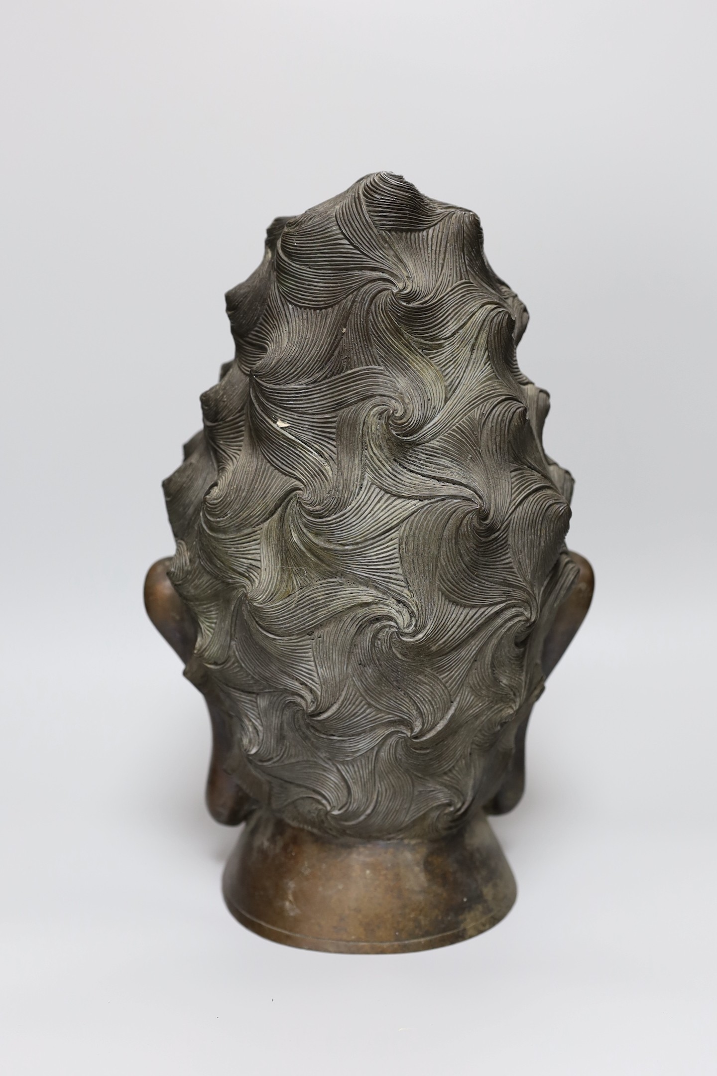 A South East Asian bronze bust of Guanyin, 34cm